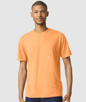 Pretreated Gildan 64000CVC Softstyle CVC T-Shirt - Model wearing Tangerine Mist tee.