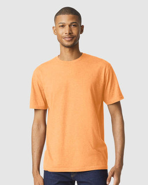 Pretreated Gildan 64000CVC Softstyle CVC T-Shirt - Model wearing Tangerine Mist tee.